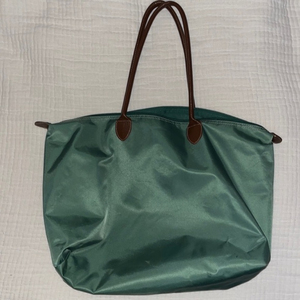 Green purse with leather straps
